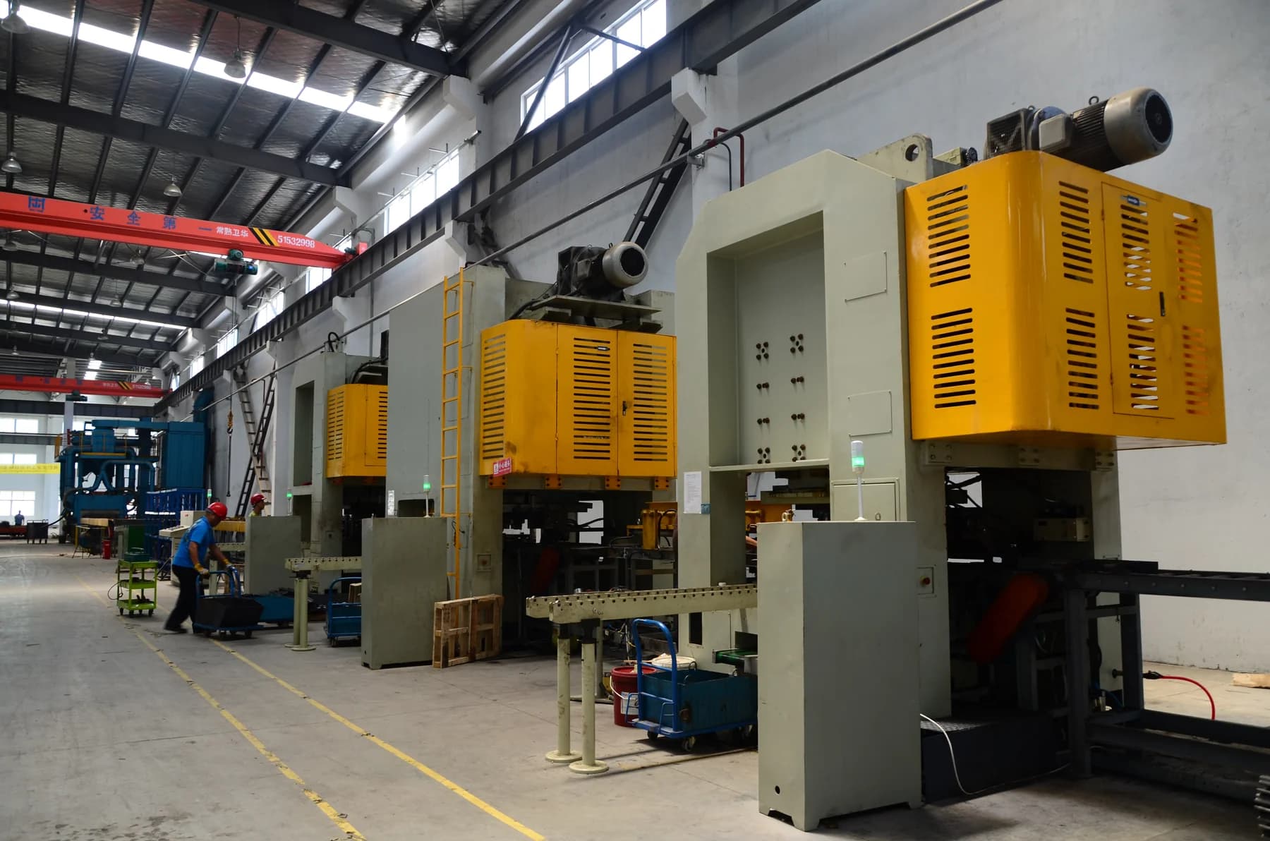 Production equipment and workers on our factory floor