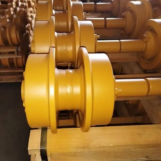Bulldozer carrier rollers arranged in rows