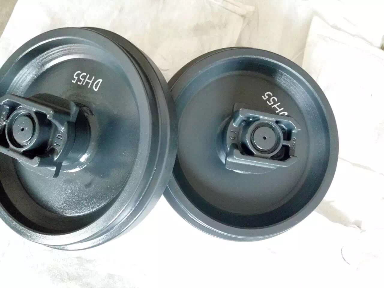 Two excavator idlers arranged side by side