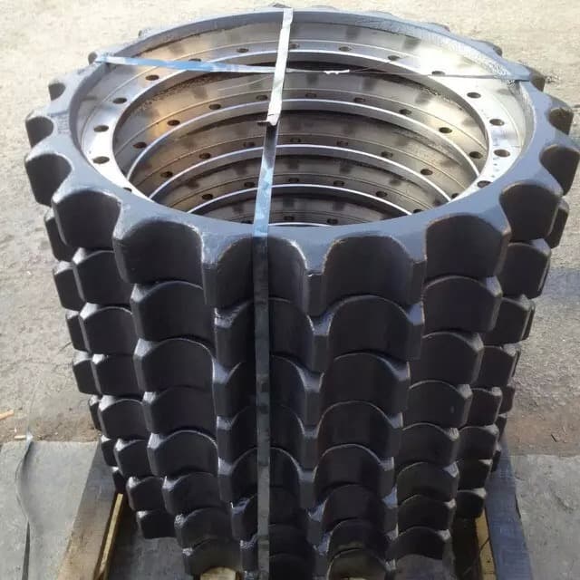 Stacked excavator drive sprockets secured with strapping