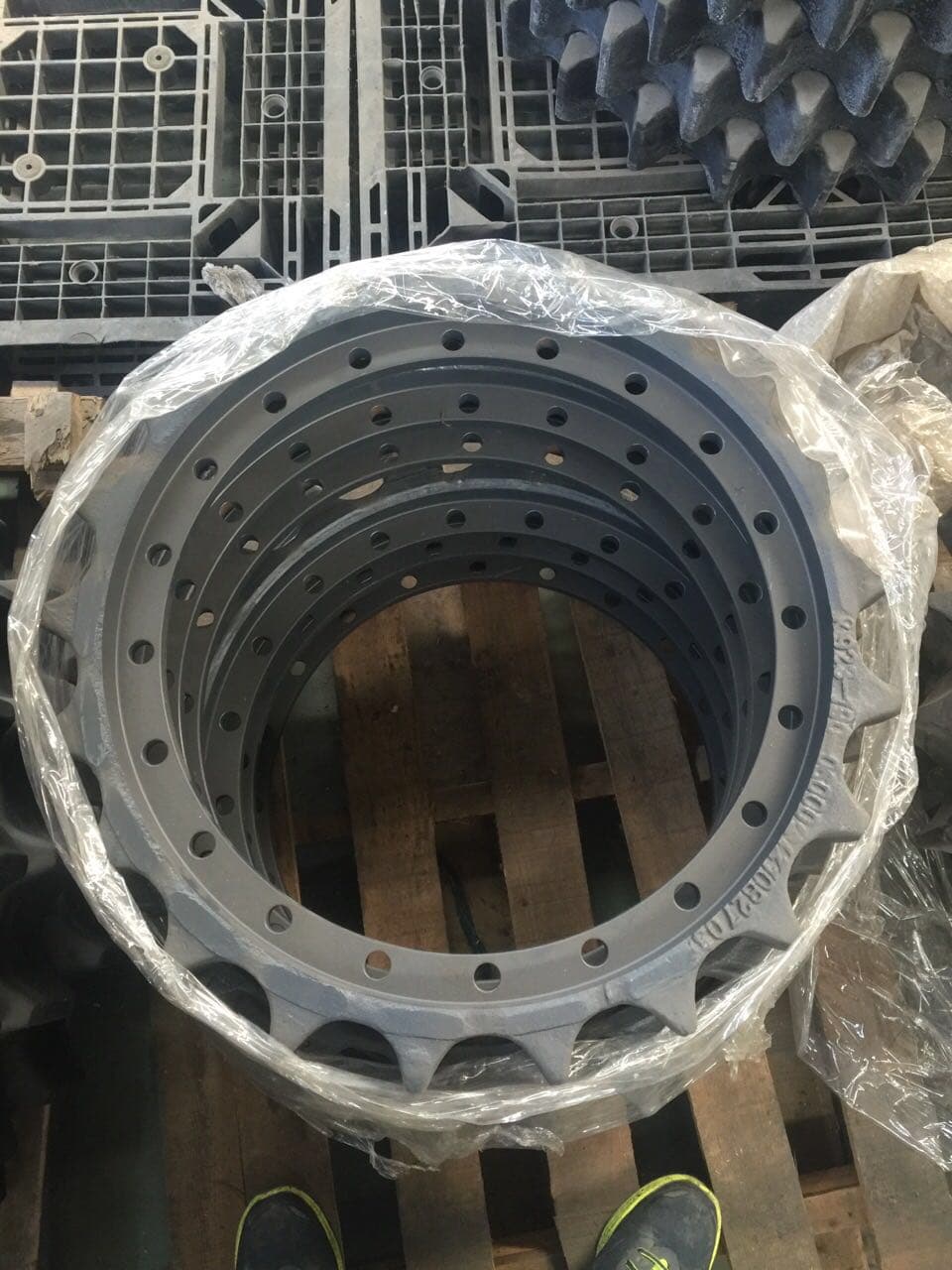 Nested excavator drive sprockets with plastic wrapping