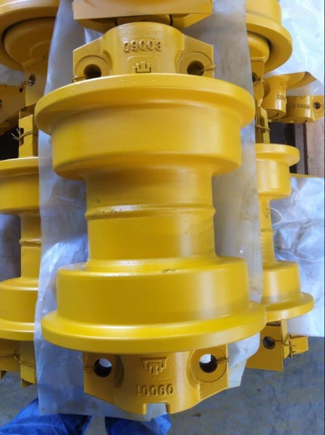 Bulldozer track roller with yellow coating