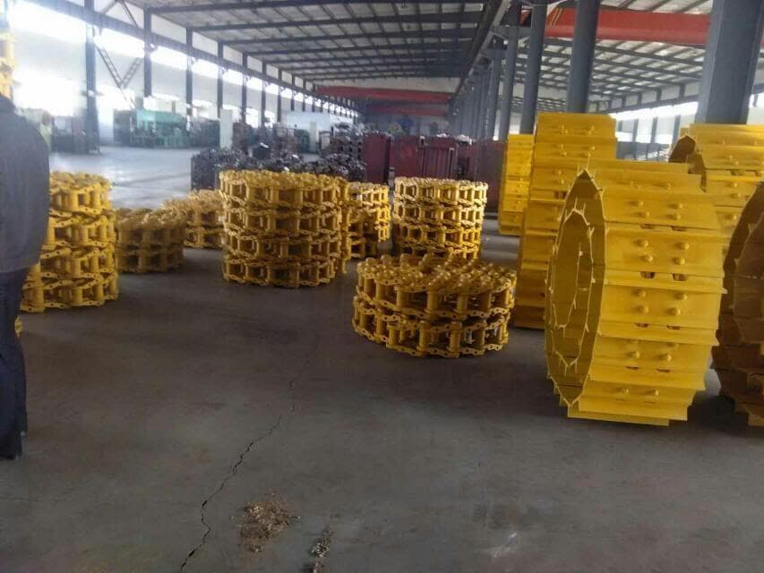 Bulldozer complete track group yellow view